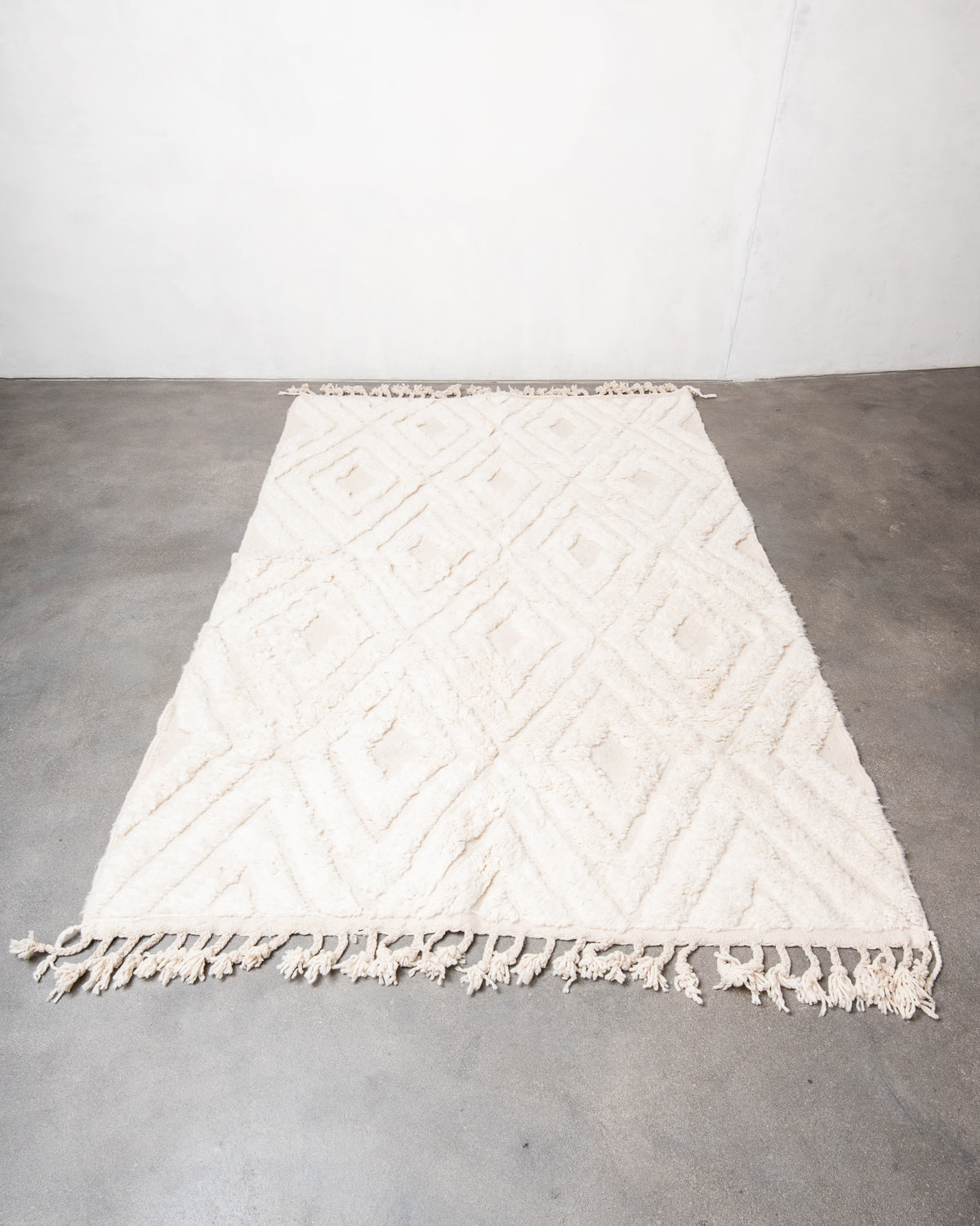 Modern, designer, handcrafted Berber rug from Morocco. Beniourain carpet with beautiful colours and patterns and fluffy wool texture.